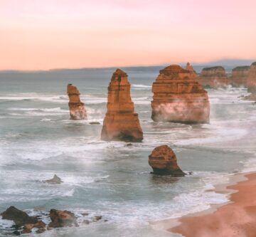 scenic image of the 12 apostles at sunrise with haze around the rocks