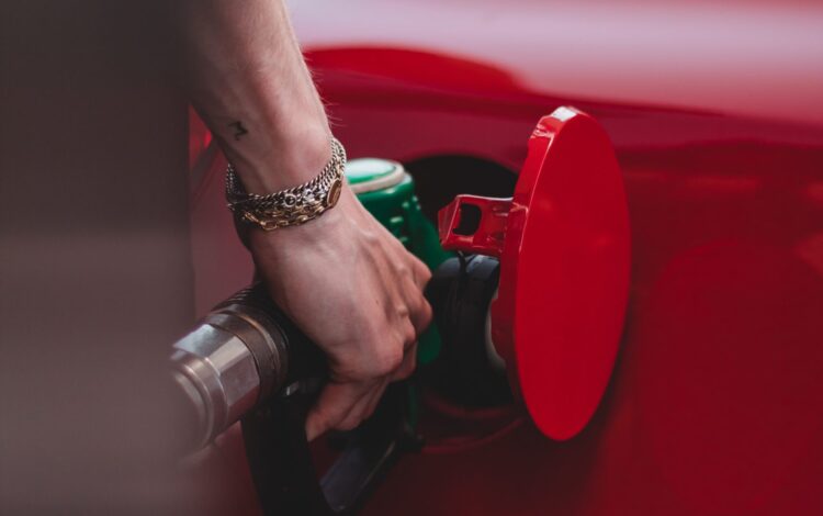 close up of putting petrol into a car