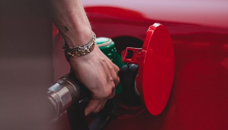 close up of putting petrol into a car