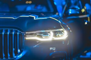 close up of vehicle with headlights on