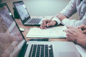 2 men managing car finances and expenses