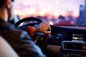 man driving new car - interior view