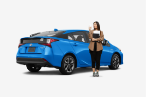 woman standing in front of blue hybrid toyota prius