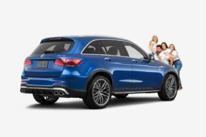 family standing in front of a blue mercedes benz GLC43