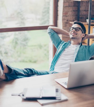 happy calm smiling man having a rest after solving all the tasks at work