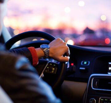 man driving new car - interior view