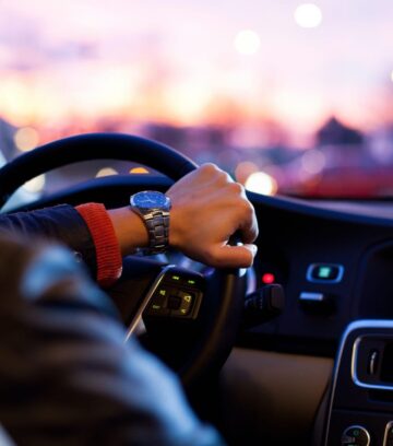 man driving new car - interior view