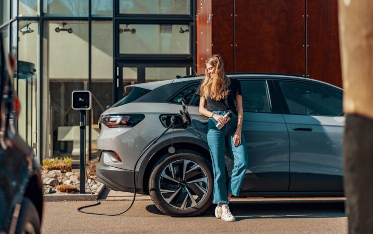 a woman charging her electric SUV