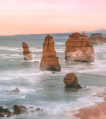 scenic image of the 12 apostles at sunrise with haze around the rocks